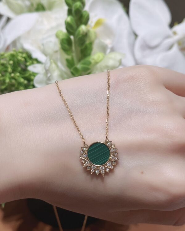 Screenshot Custom Solid 18k Gold Piaget Sunlight Pendant in 18K Rose Gold Set with a Malachite (approx. 2.30 cts) and 28 Brilliant-Cut Diamonds (approx. 0.17 ct)