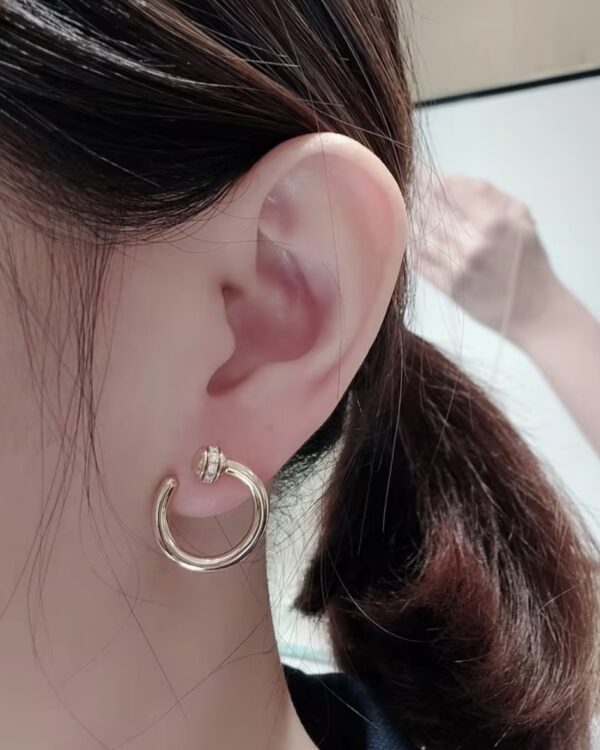 Screenshot Custom Solid 18k Gold Piaget Possession Open Hoop Earrings in 18K Rose Gold Set with 20 Brilliant-Cut Diamonds (approx. 0.20 ct)