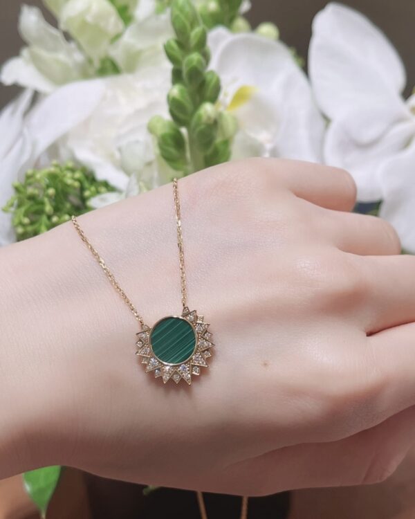 Screenshot Custom Solid 18k Gold Piaget Sunlight Pendant in 18K Rose Gold Set with a Malachite (approx. 2.30 cts) and 28 Brilliant-Cut Diamonds (approx. 0.17 ct)