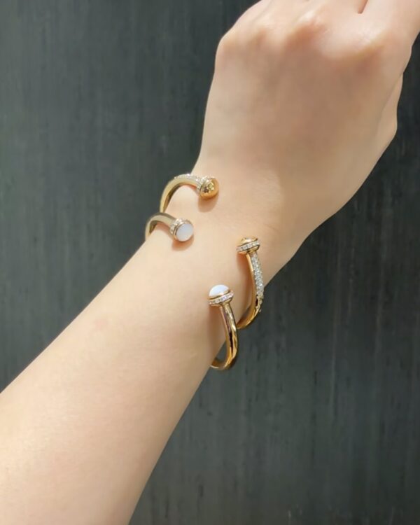 Screenshot Custom Solid 18k Gold Piaget Possession Open Bangle Bracelet in 18K Rose Gold Set with 30 Brilliant-Cut Diamonds