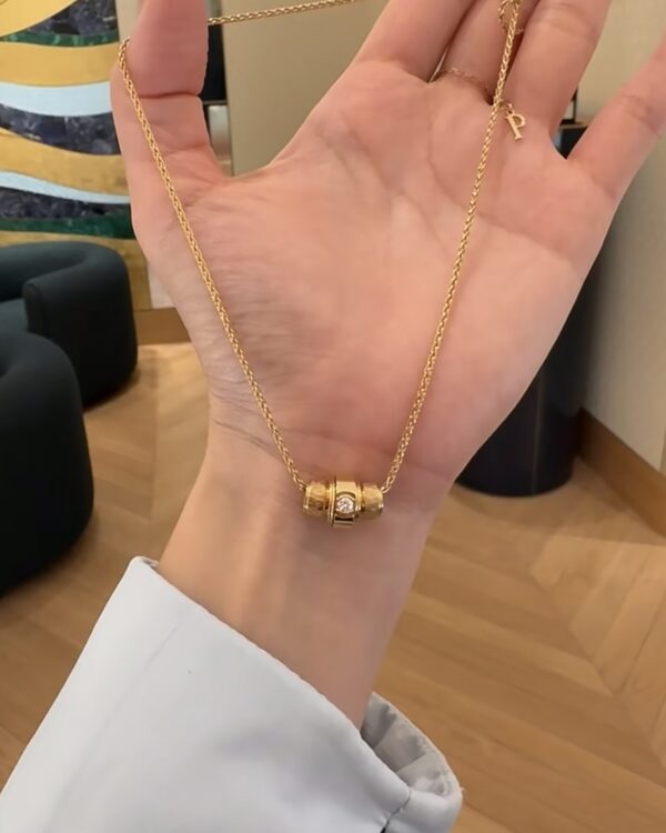 Screenshot Custom Solid 18k Gold Piaget Possession "Decor Palace" Pendant in 18K Rose Gold Set with One Possession-Set Brilliant-Cut Diamond (approx. 0.09 ct)