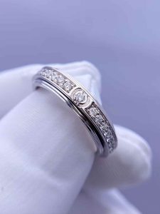 Custom Solid 18k Gold Piaget Jewelry Possession Ring in rhodium finish set with 36 brilliant-cut diamonds and one Possession-set brilliant-cut diamond